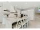 Modern white kitchen with marble countertops, large island, and high-end appliances at 149 Mckinley Dr, Sarasota, FL 34236