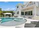 Resort-style pool and spa with lounge chairs, creating an outdoor oasis at 149 Mckinley Dr, Sarasota, FL 34236