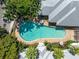 Aerial view of community pool and surrounding buildings at 3702 54Th W Dr # 102, Bradenton, FL 34210