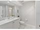 Updated bathroom with white vanity, quartz countertop, and toilet at 3702 54Th W Dr # 102, Bradenton, FL 34210