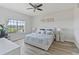 Main bedroom with king-size bed and ceiling fan at 3702 54Th W Dr # 102, Bradenton, FL 34210