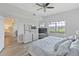 Main bedroom with king-size bed and large windows at 3702 54Th W Dr # 102, Bradenton, FL 34210