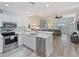 Modern kitchen with white cabinets and stainless steel appliances at 3702 54Th W Dr # 102, Bradenton, FL 34210