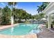 Inviting community pool with surrounding landscaping and patio area at 3702 54Th W Dr # 102, Bradenton, FL 34210