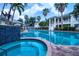 Resort-style pool and spa with surrounding landscaping and patio furniture at 3702 54Th W Dr # 102, Bradenton, FL 34210