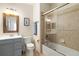 Bathroom boasts a large shower and modern vanity at 6918 Grand Estuary Trl # 102, Bradenton, FL 34212