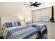 Comfortable guest bedroom with two twin-size beds at 6918 Grand Estuary Trl # 102, Bradenton, FL 34212