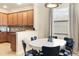 Casual dining area with round table and navy blue chairs at 6918 Grand Estuary Trl # 102, Bradenton, FL 34212