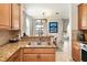 Modern kitchen with granite counters and stainless steel appliances at 6918 Grand Estuary Trl # 102, Bradenton, FL 34212