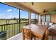 Spacious screened balcony with patio furniture and golf course views at 6918 Grand Estuary Trl # 102, Bradenton, FL 34212