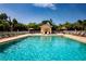 Sparkling pool with lounge chairs and shaded cabana area at 5230 Hyland Hills Ave # 1315, Sarasota, FL 34241