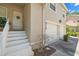 Townhome exterior featuring a front entrance with stairs and an attached garage at 6736 Fairview Ter # 6736, Bradenton, FL 34203