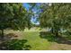 Scenic golf course view framed by lush trees at 6736 Fairview Ter # 6736, Bradenton, FL 34203