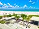 Aerial view of Siesta Beach with pavilion and ocean at 1150 Windsong Ln # 200, Sarasota, FL 34242