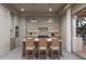 Contemporary kitchen with light wood cabinets and center island at 1150 Windsong Ln # 200, Sarasota, FL 34242