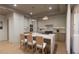 Modern kitchen with island, stainless steel appliances, and hardwood floors at 1150 Windsong Ln # 200, Sarasota, FL 34242