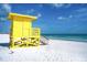Bright yellow lifeguard stand on a beautiful, tranquil beach at 1150 Windsong Ln # 200, Sarasota, FL 34242