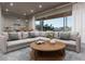 Bright living room featuring a sectional sofa and coffee table at 1150 Windsong Ln # 200, Sarasota, FL 34242