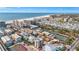 Aerial view of beachfront community with tennis courts and ocean at 1150 Windsong Ln # 300, Sarasota, FL 34242