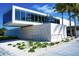 Modern Siesta Beach pavilion with expansive windows and white exterior at 1150 Windsong Ln # 300, Sarasota, FL 34242