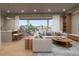 Open concept living room with modern furniture and balcony view at 1150 Windsong Ln # 300, Sarasota, FL 34242