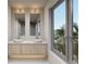 Double vanity bathroom with modern sinks and large mirrors at 1150 Windsong Ln # 400, Sarasota, FL 34242