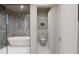 Bathroom with a soaking tub, walk-in shower, and toilet at 1150 Windsong Ln # 400, Sarasota, FL 34242
