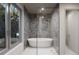 Spa-like bathroom with a freestanding tub and walk-in shower at 1150 Windsong Ln # 400, Sarasota, FL 34242