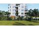 Modern building with garage and lush landscaping at 1150 Windsong Ln # 400, Sarasota, FL 34242