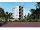 Modern building with exterior stairs and balconies at 1150 Windsong Ln # 400, Sarasota, FL 34242