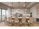 Modern kitchen with island, light wood cabinets, and bar stools at 1150 Windsong Ln # 400, Sarasota, FL 34242