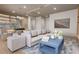 Living room with light blue coffee table and comfortable sofa at 1150 Windsong Ln # 400, Sarasota, FL 34242