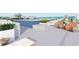 Relaxing rooftop terrace with pool and seating at 1150 Windsong Ln # 400, Sarasota, FL 34242