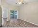 Large bedroom with wood floors, a screened-in porch, and ample closet space at 318 Chartley N Ct, Sarasota, FL 34232