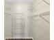 Walk-in closet with wire shelving and wood-look floor at 318 Chartley N Ct, Sarasota, FL 34232
