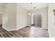 Cozy dining room with wood floors, chandelier, and access to the patio at 318 Chartley N Ct, Sarasota, FL 34232