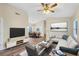 Bright living room with modern decor, wood floors, and a comfortable seating area at 318 Chartley N Ct, Sarasota, FL 34232