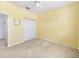 Simple bedroom with neutral walls and carpet at 6655 41St Street E Cir, Sarasota, FL 34243