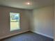 Bright bedroom with carpet and a large window at 2738 N Chamberlain Blvd, North Port, FL 34286