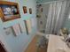 Bathroom with shower, toilet and ample storage at 4906 Sea Island Ave, Sarasota, FL 34234