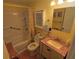 Clean bathroom with tub, shower, and granite vanity at 4906 Sea Island Ave, Sarasota, FL 34234