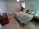 Spacious bedroom with king bed, light walls, and lots of closet space at 4906 Sea Island Ave, Sarasota, FL 34234