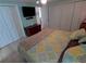 King bed, large closets, and TV in bright bedroom at 4906 Sea Island Ave, Sarasota, FL 34234