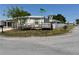 Side view of a manufactured home with ramp access and fence at 4906 Sea Island Ave, Sarasota, FL 34234