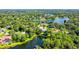 Bird's-eye view of house nestled in a lakeside community at 7430 Weeping Willow Dr, Sarasota, FL 34241