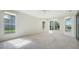 Empty bedroom featuring wall-to-wall carpeting and a window with a view at 7430 Weeping Willow Dr, Sarasota, FL 34241