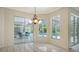 Breakfast nook with view of the pool and patio area at 7430 Weeping Willow Dr, Sarasota, FL 34241