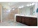 Bathroom features a glass shower and a dual sink vanity with lots of counter space at 9769 Highland Park Pl, Palmetto, FL 34221