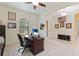 Comfortable office space with a ceiling fan, front door, and American flag at 9769 Highland Park Pl, Palmetto, FL 34221