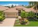 Charming single-story home featuring a tile roof, landscaped yard and brick-paved driveway at 7167 Whitemarsh Cir, Lakewood Ranch, FL 34202